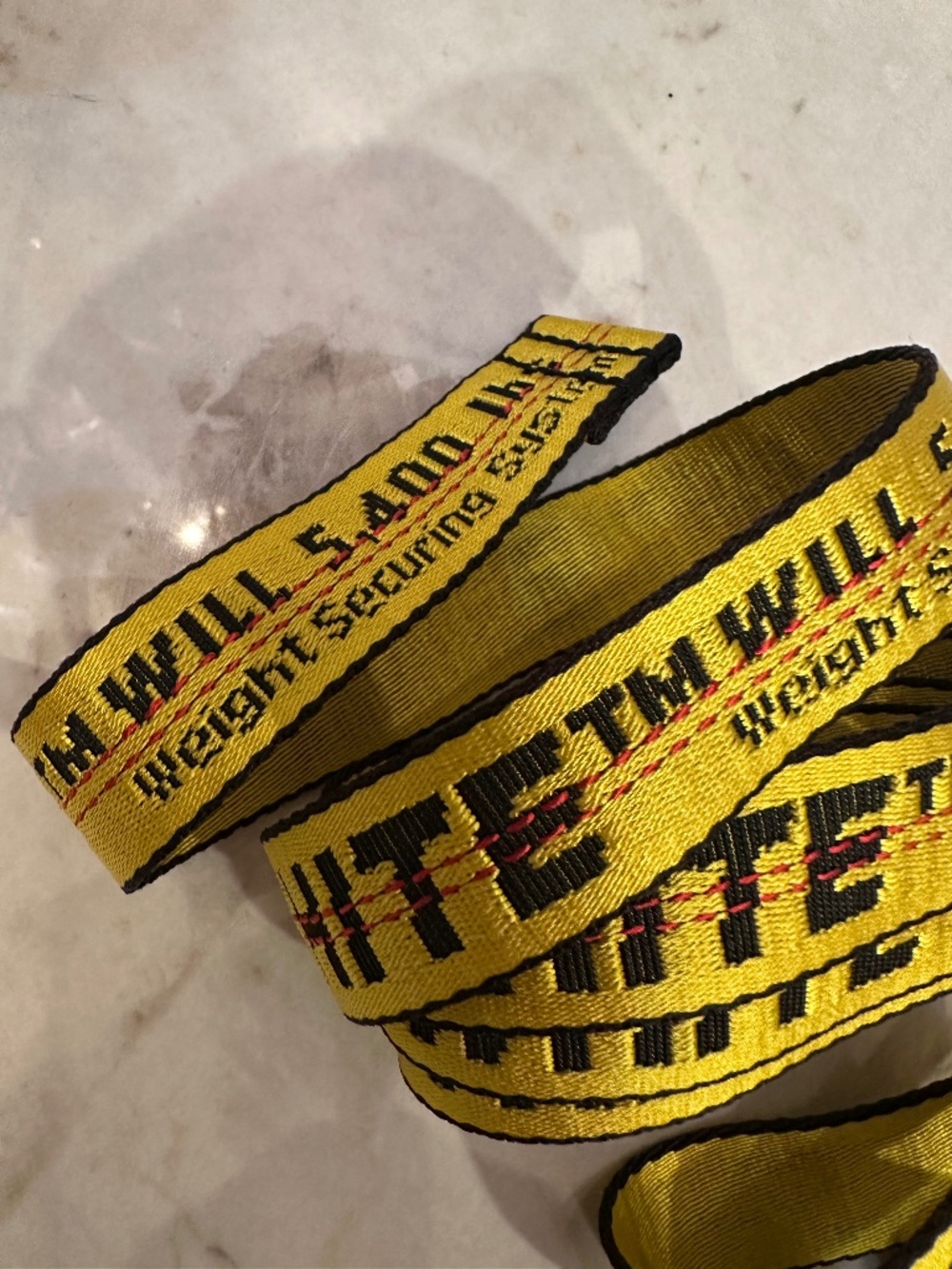 Off-White yellow & black strap fabric by with repeating text #offwhite